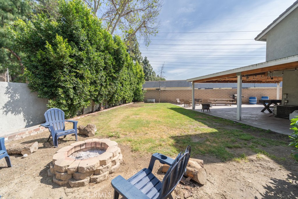 8636 Rancho Cerona Drive Paramount, CA 90723 - Photo 43 of 48 a swimming pool with outdoor seating and yard