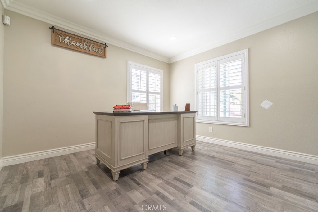 8636 Rancho Cerona Drive Paramount, CA 90723 - Photo 7 of 48 a room with a wooden floor and a window