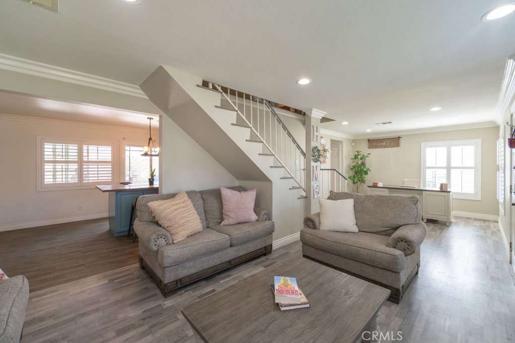 8636 Rancho Cerona Drive Paramount, CA 90723 - Photo 10 of 48 a living room with furniture and wooden floor