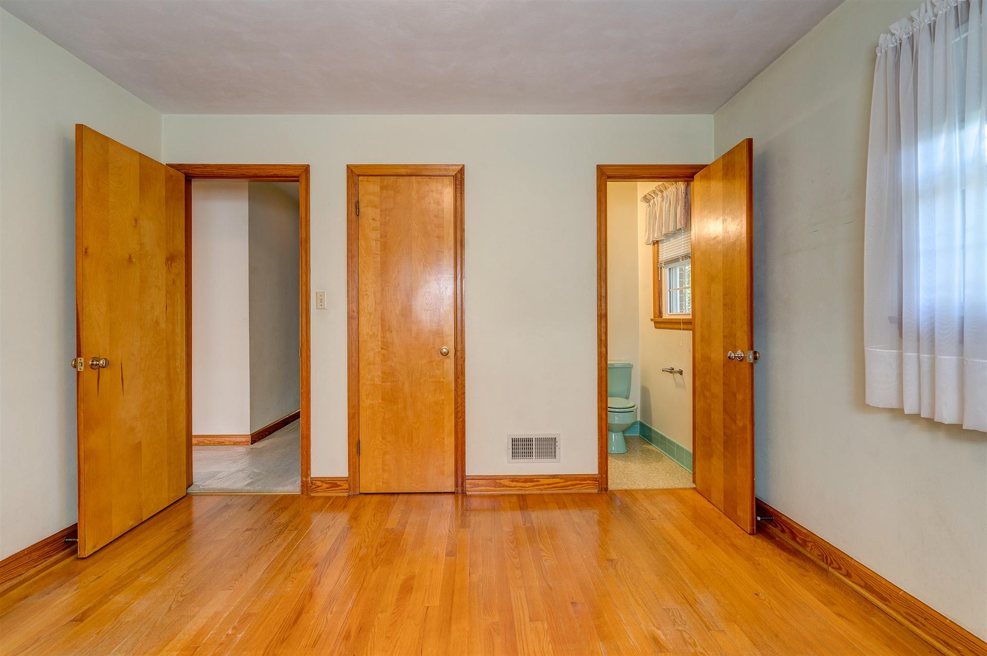 1702 Eanes Road Roanoke, VA 24014 - Photo 12 of 21 an empty room with wooden floor and closet