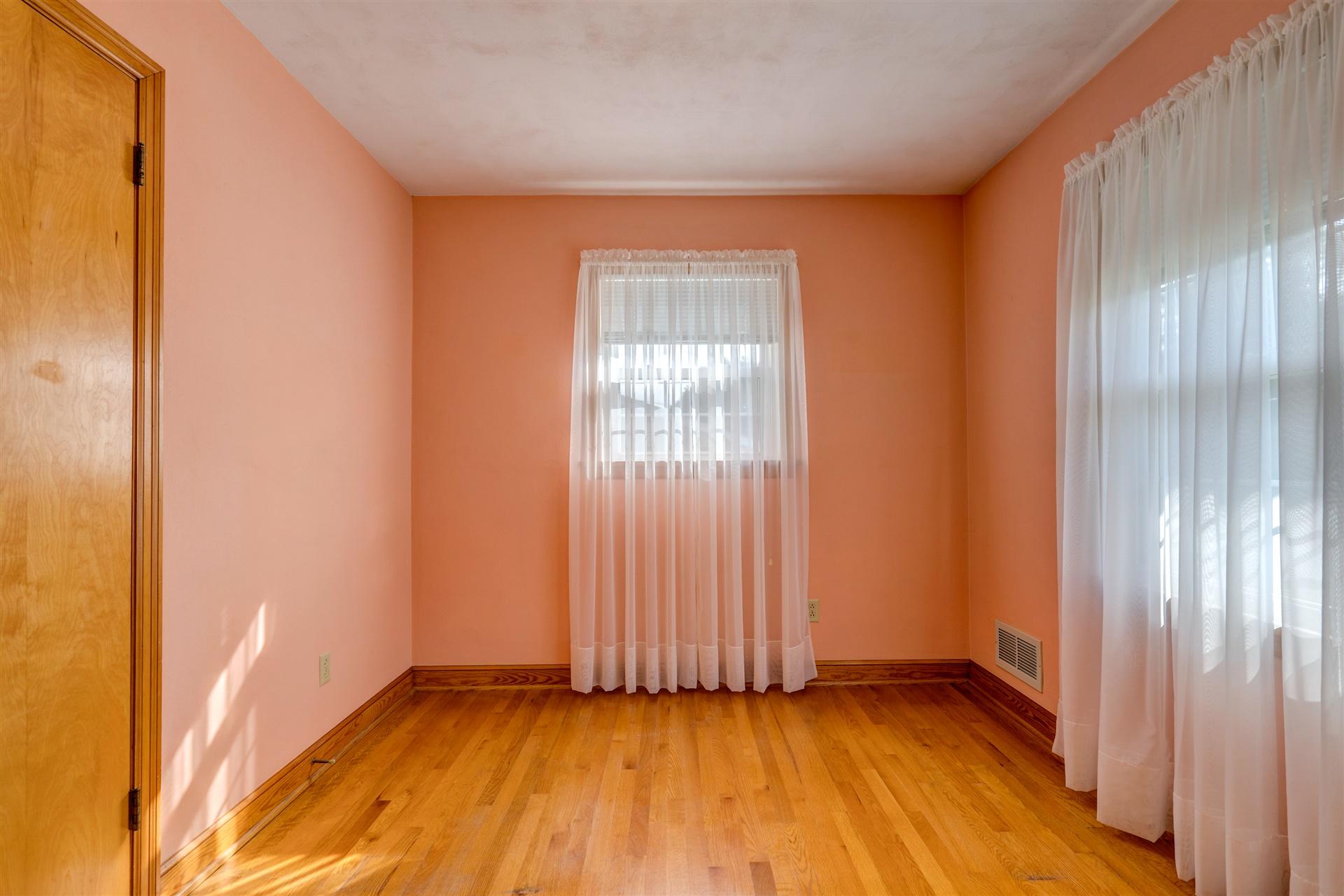 1702 Eanes Road Roanoke, VA 24014 - Photo 14 of 21 a view of an empty room with wooden floor and a window