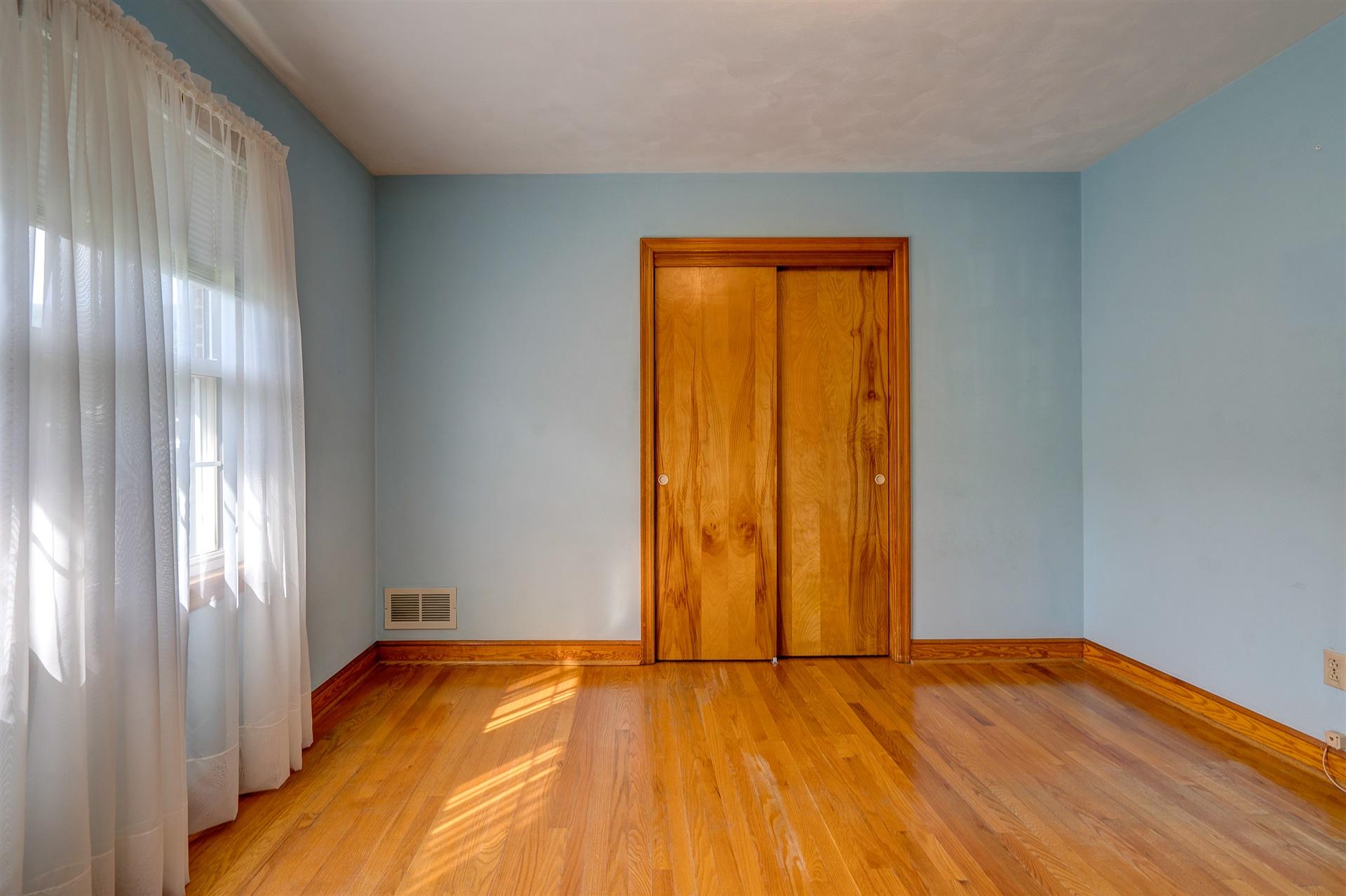 1702 Eanes Road Roanoke, VA 24014 - Photo 16 of 21 a view of an empty room with wooden floor and a window