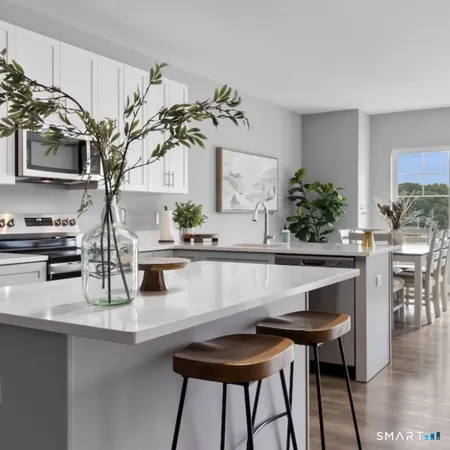 a table with a vase and flowers on it