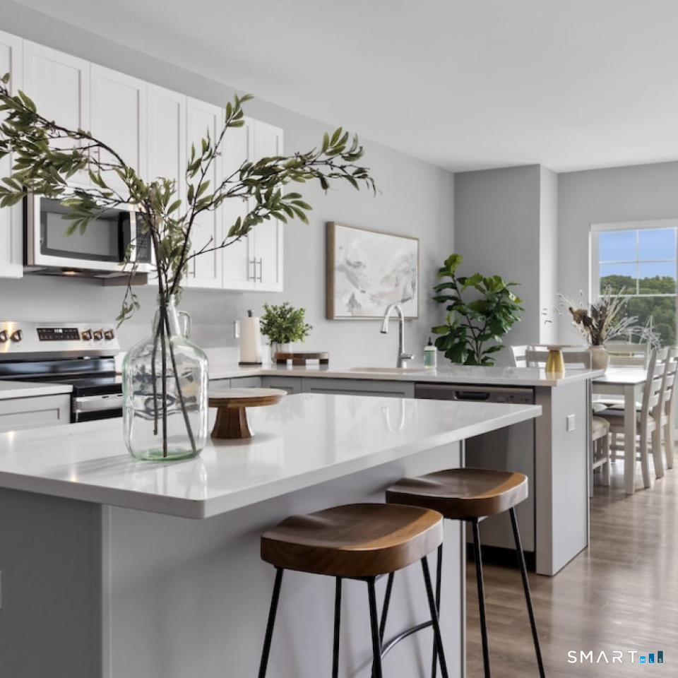 a table with a vase and flowers on it