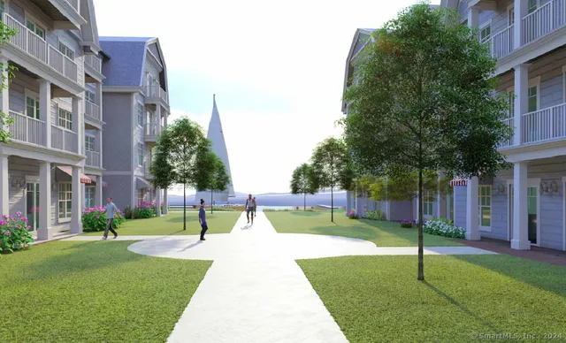 a view of a house with a yard and a tree