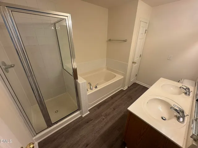 a bathroom with a tub and a sink