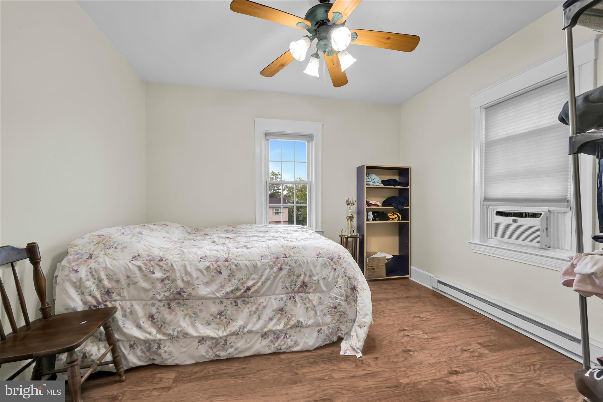 121 East Cumberland Road Enola, PA 17025 - Photo 14 of 27 a bedroom with a bed and a chandelier
