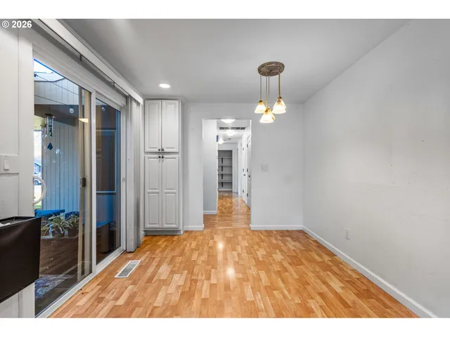 a kitchen with stainless steel appliances granite countertop a stove top oven a sink dishwasher a refrigerator and a microwave