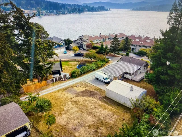 an aerial view of a house with a lake view