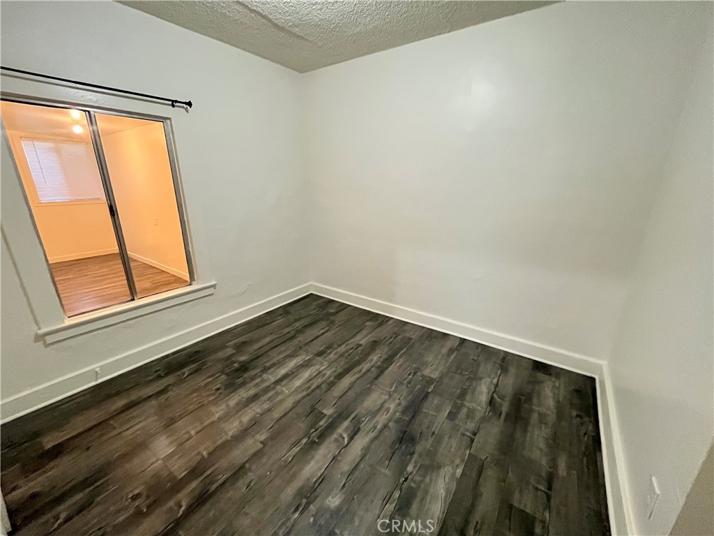 1588 West 37th Street, Unit 1/2 Los Angeles, CA 90018 - Photo 8 of 17 a view of a room that has a window