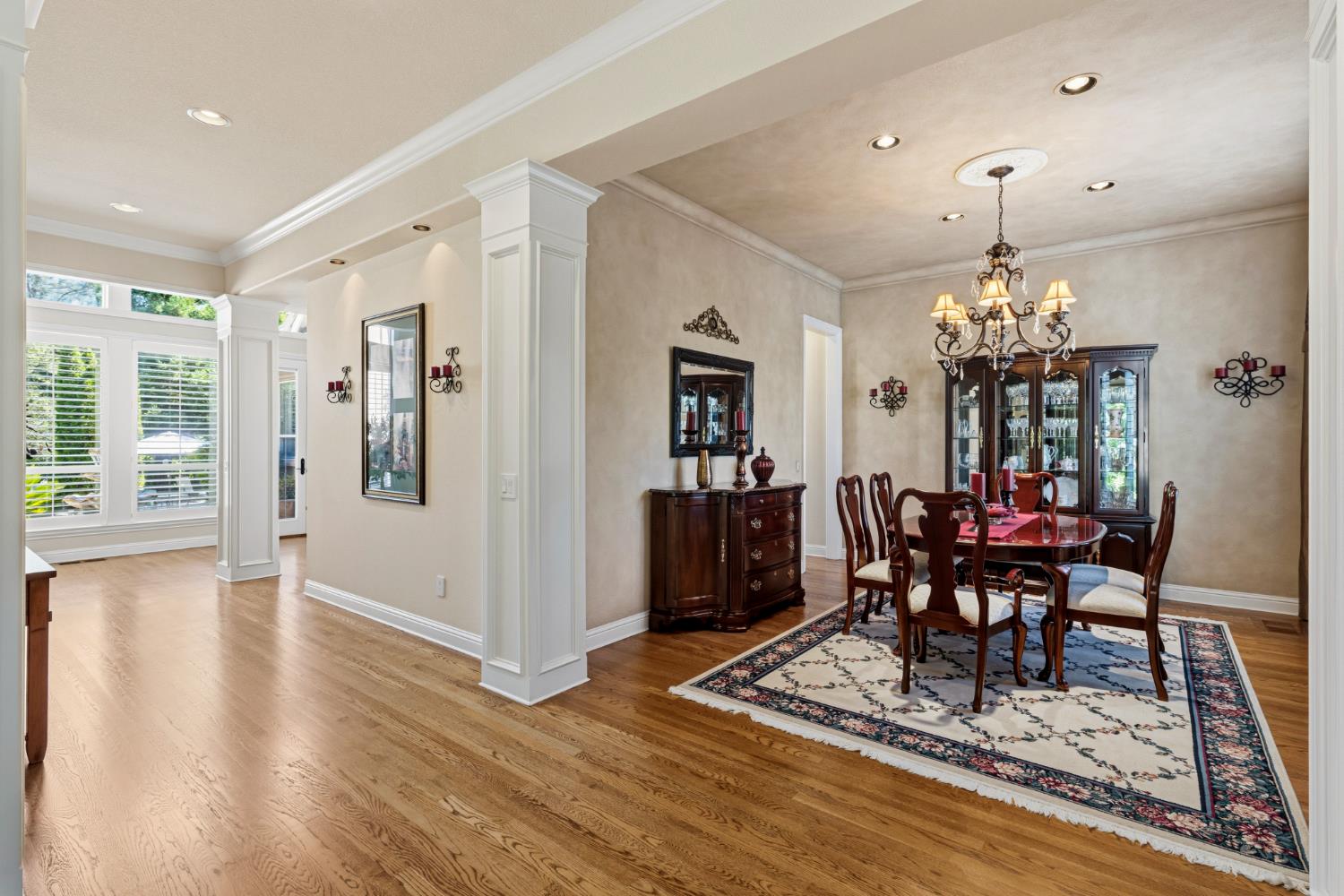 5869 Granite Hills Drive South Granite Bay, CA 95746 - Photo 7 of 66 a dining room with furniture a chandelier and wooden floor