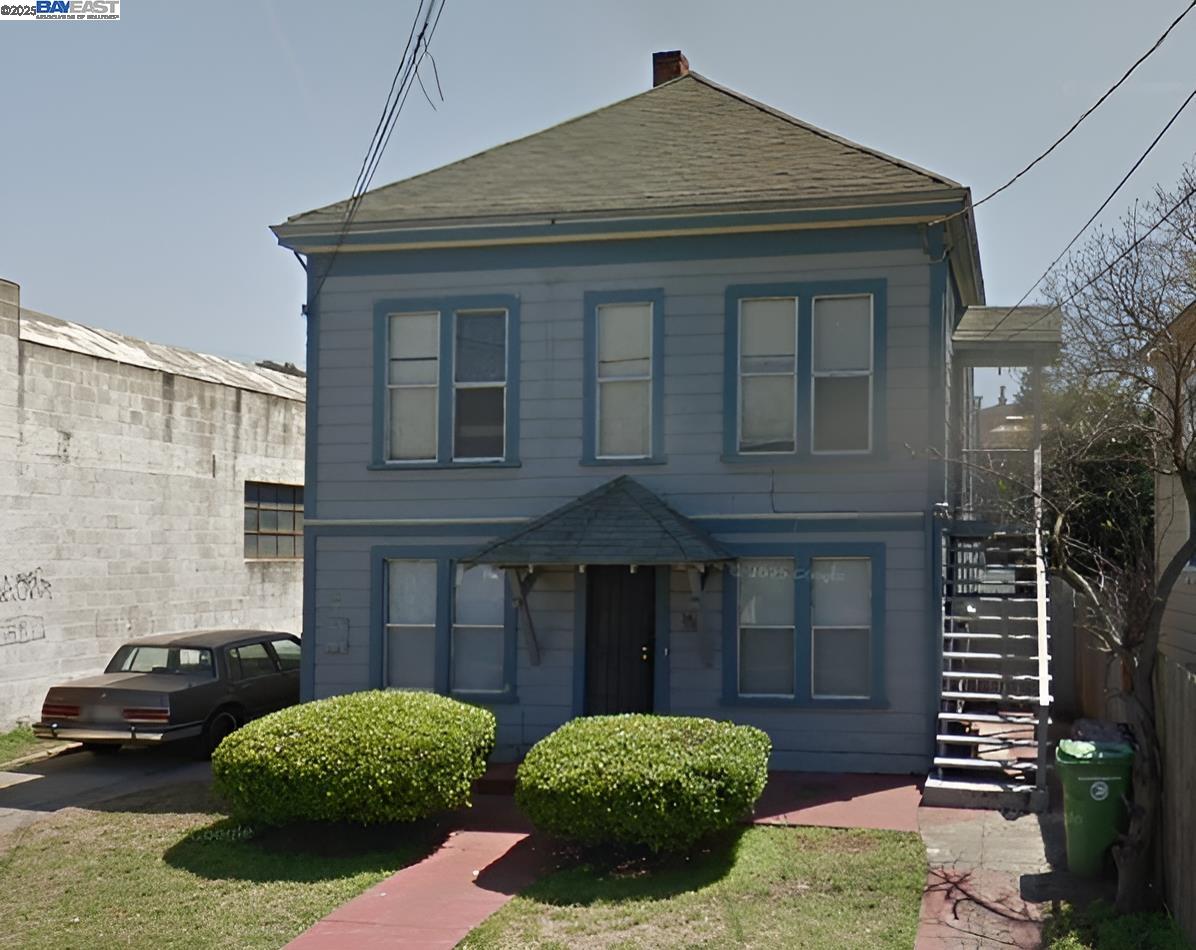a view of a brick house with many windows
