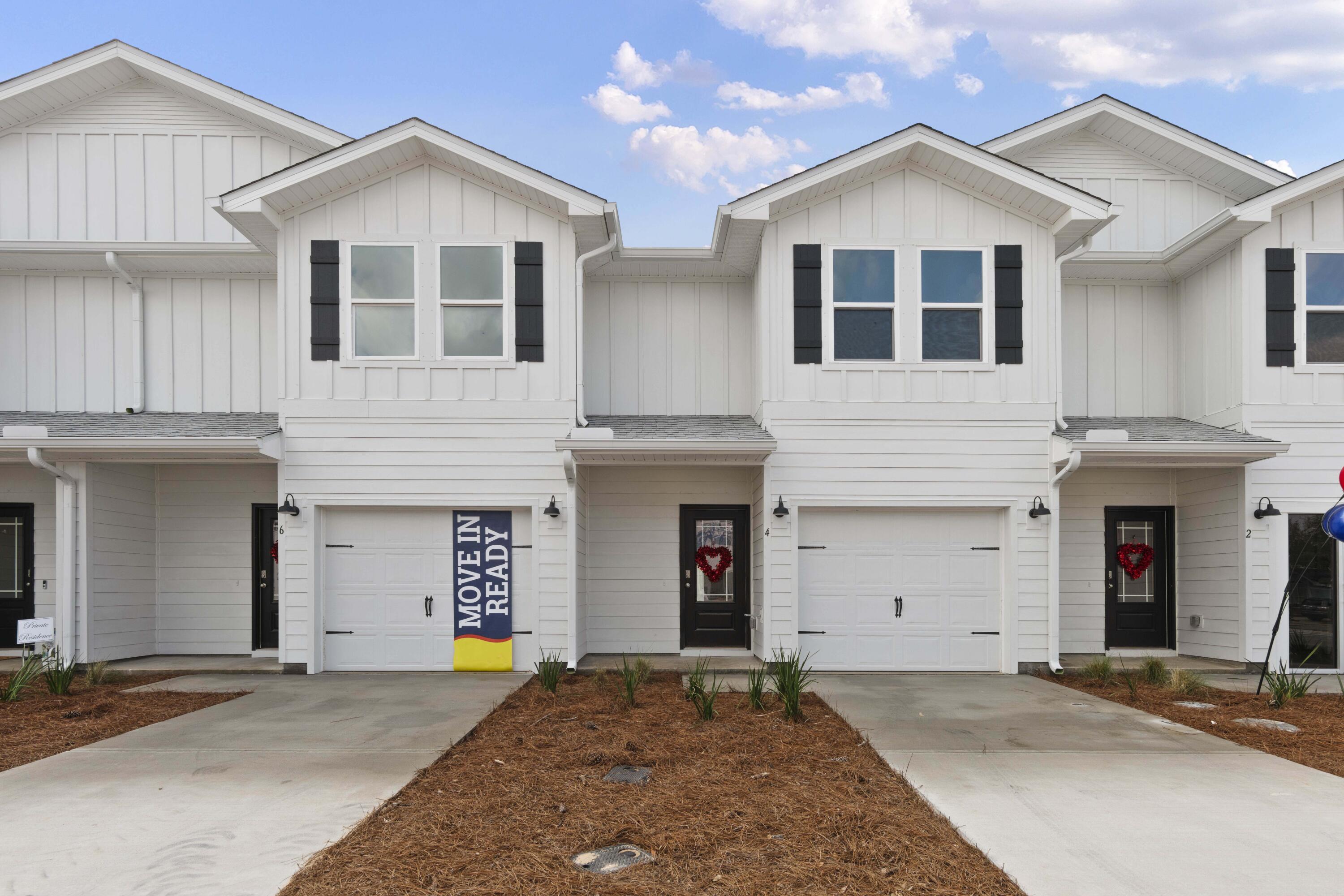 a front view of a house with yard