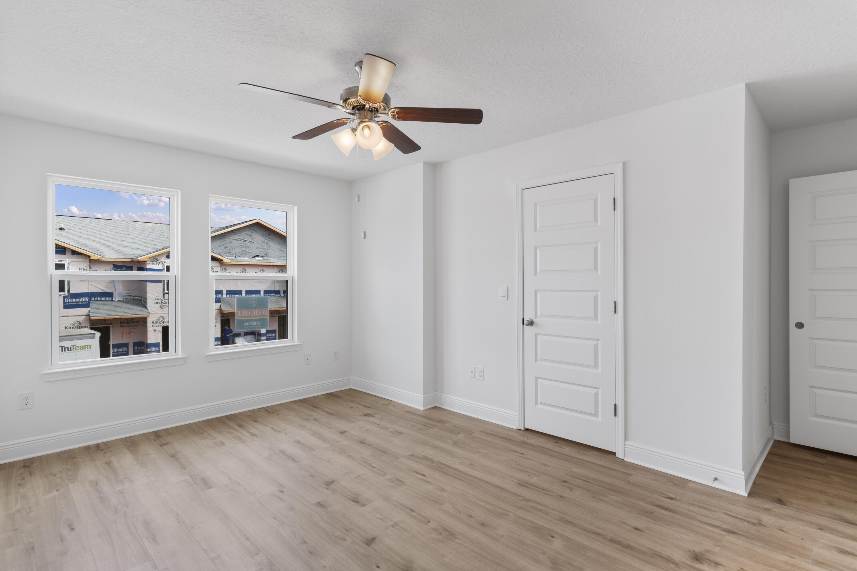4 Renea Cove Destin, FL 32541 - Photo 15 of 21 a view of an empty room with a window and wooden floor