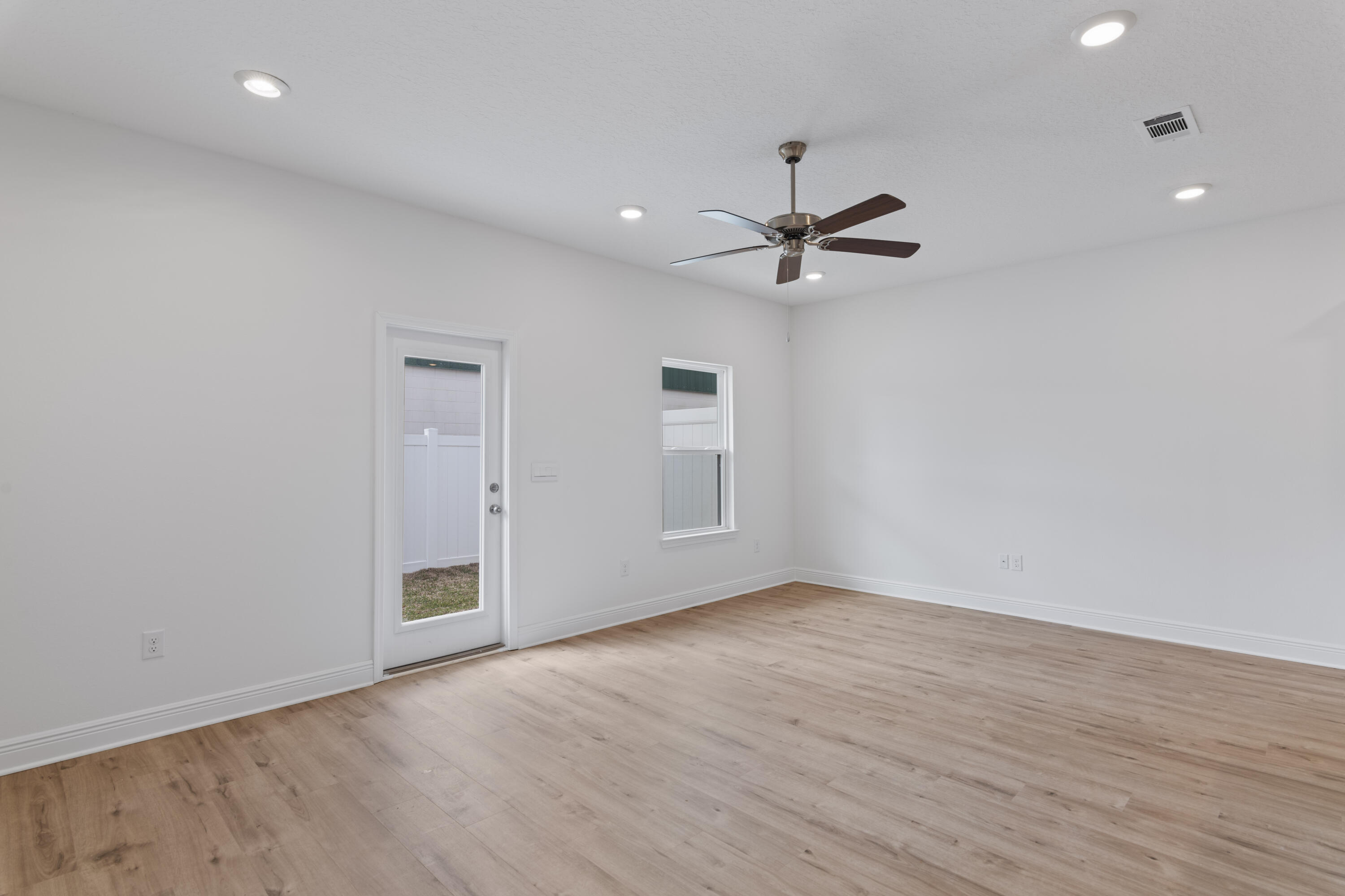4 Renea Cove Destin, FL 32541 - Photo 9 of 21 wooden floor in an empty room with a window