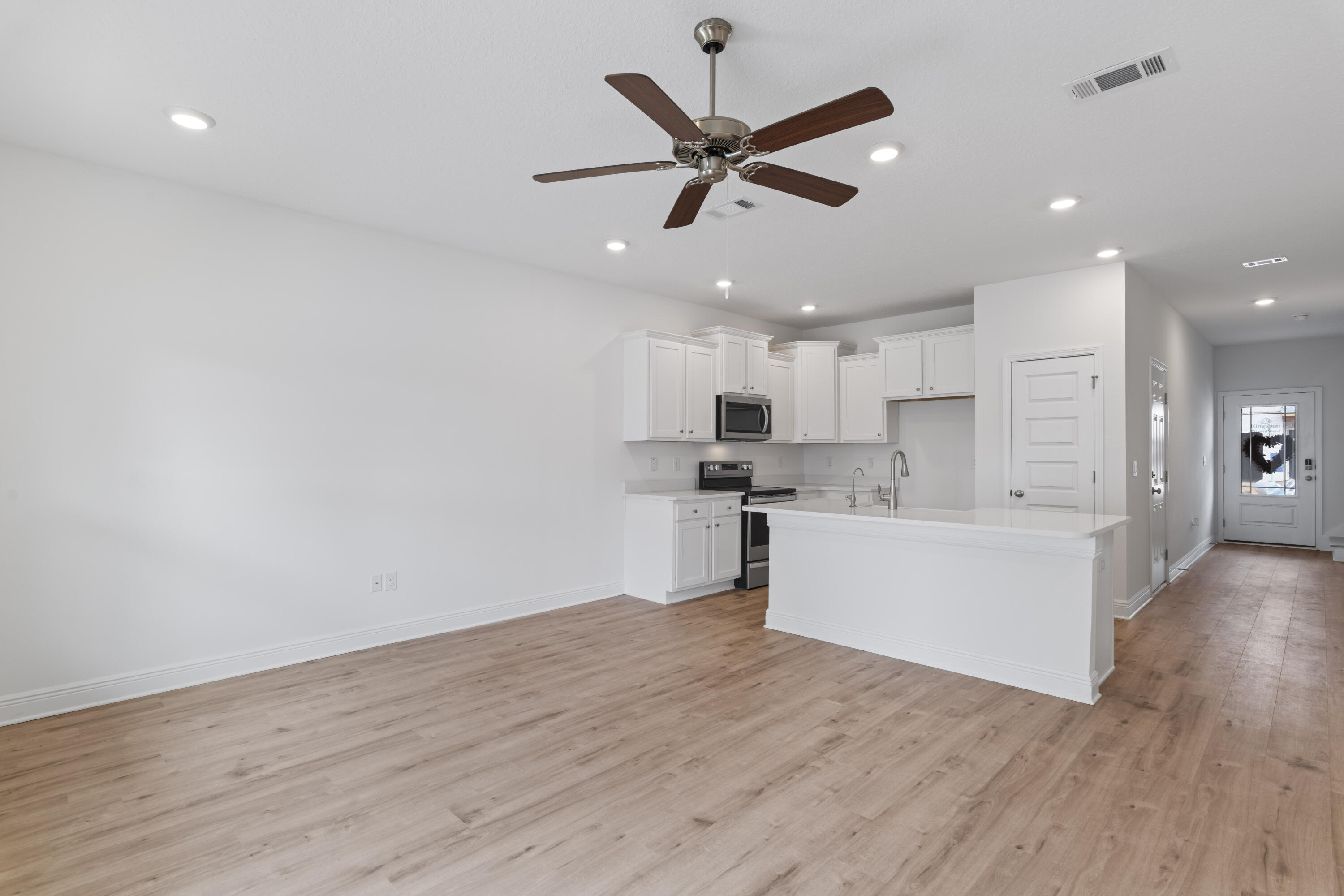4 Renea Cove Destin, FL 32541 - Photo 10 of 21 a view of kitchen with cabinets wooden floor and appliances