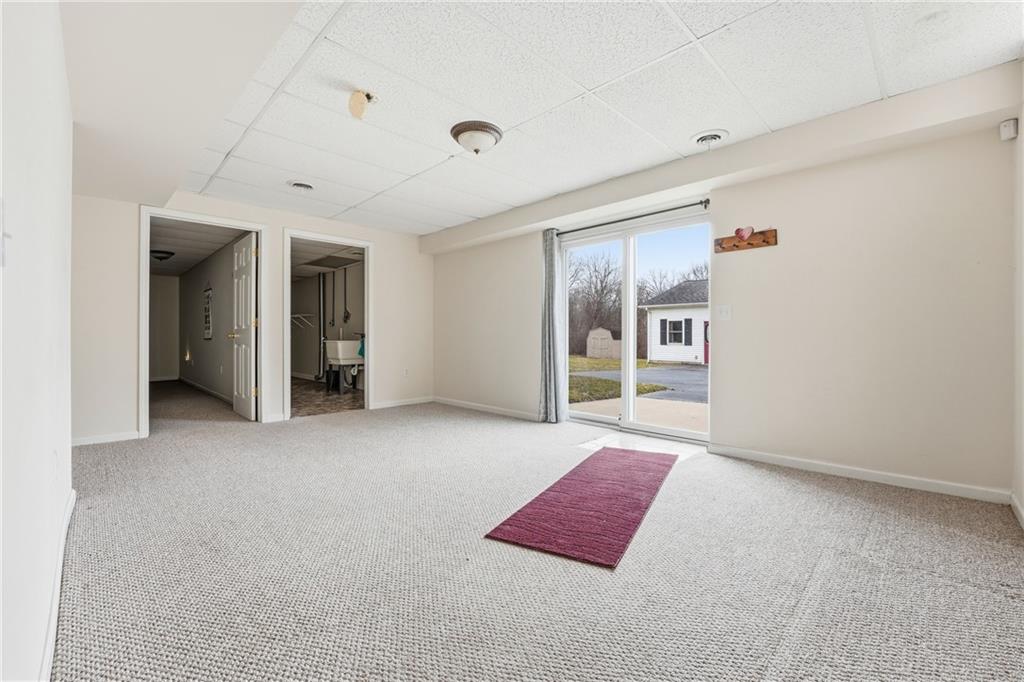 3699 Mitchell Road New Castle, PA 16105 - Photo 12 of 14 a spacious bedroom with a bed and a view of bathroom