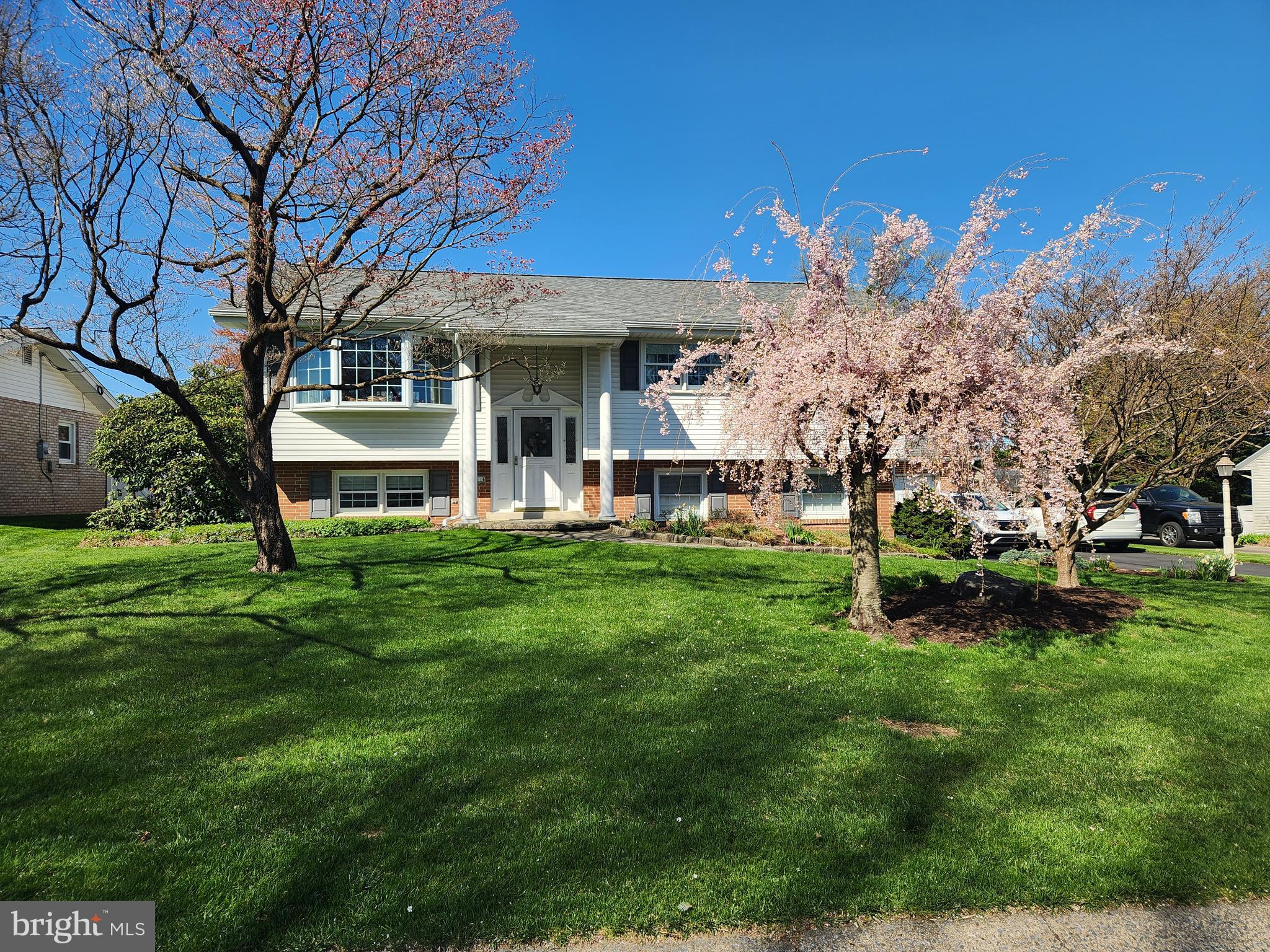 1116 Devonshire Road Lancaster, PA 17601 - Photo 30 of 70 a view of a house with a big yard and large trees