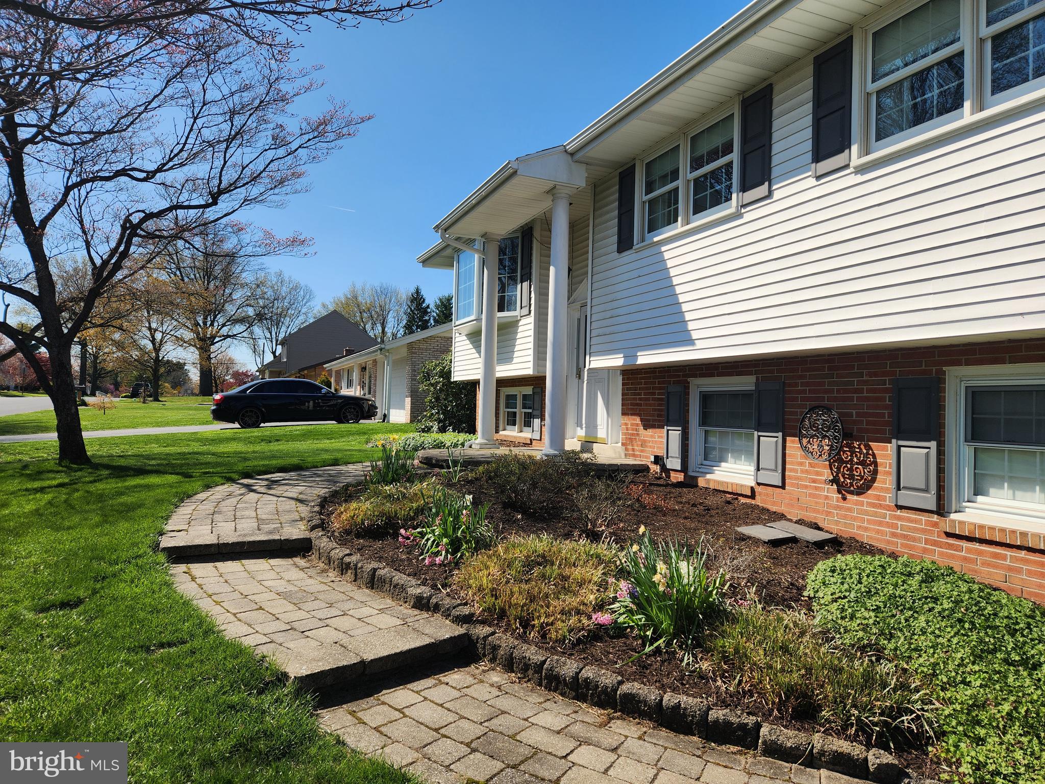 1116 Devonshire Road Lancaster, PA 17601 - Photo 39 of 70 a front view of a house with garden and trees