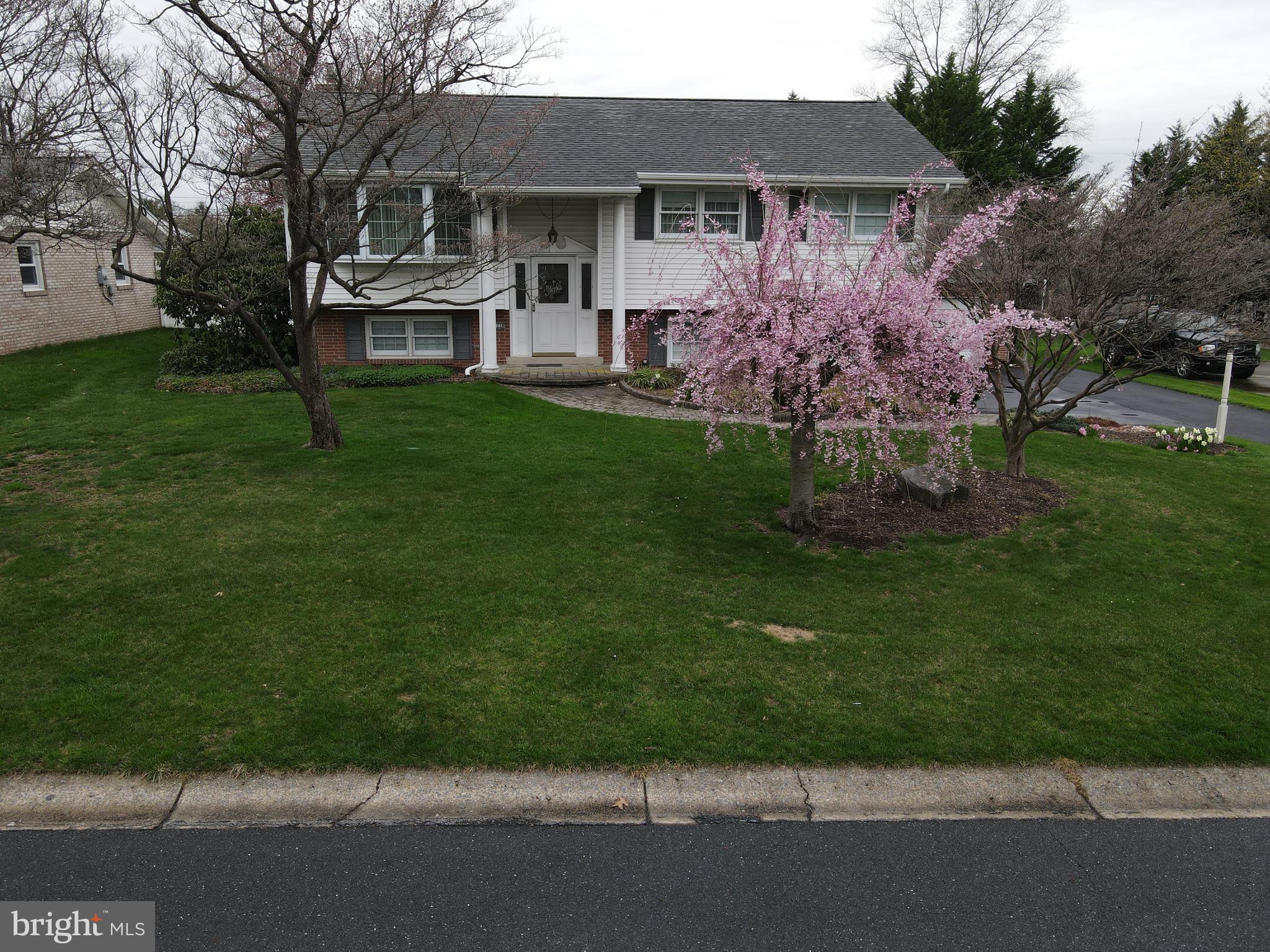 1116 Devonshire Road Lancaster, PA 17601 - Photo 51 of 70 a front view of a house with a garden and trees