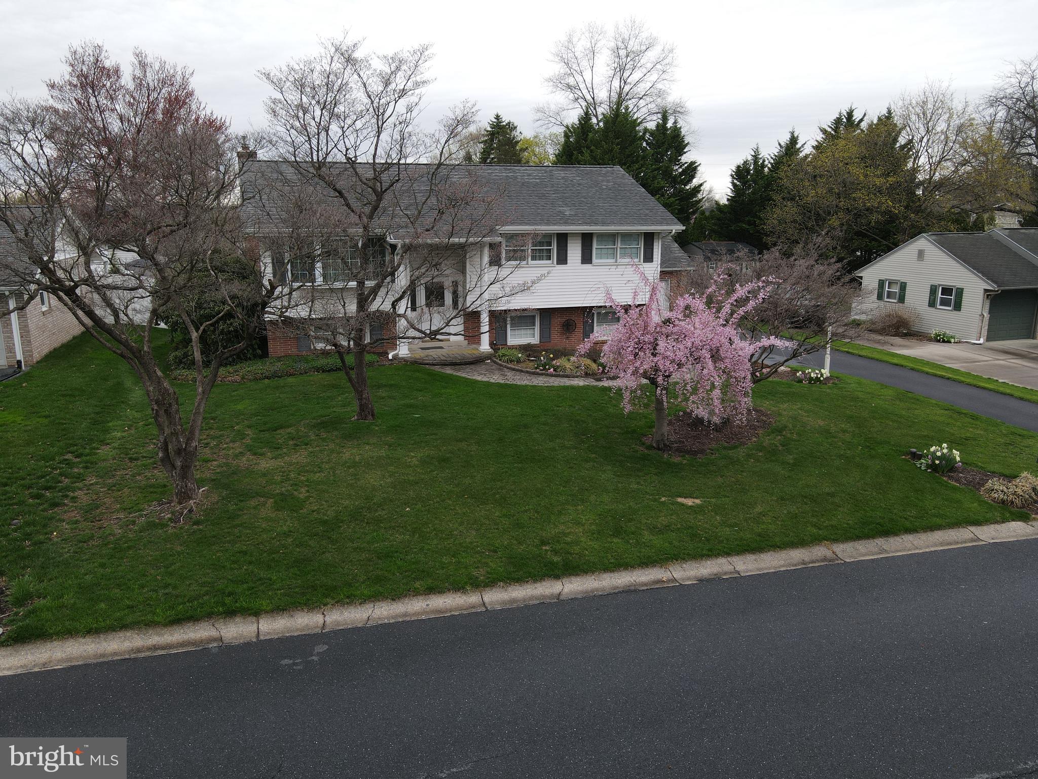 1116 Devonshire Road Lancaster, PA 17601 - Photo 53 of 70 a front view of a house with a garden and trees