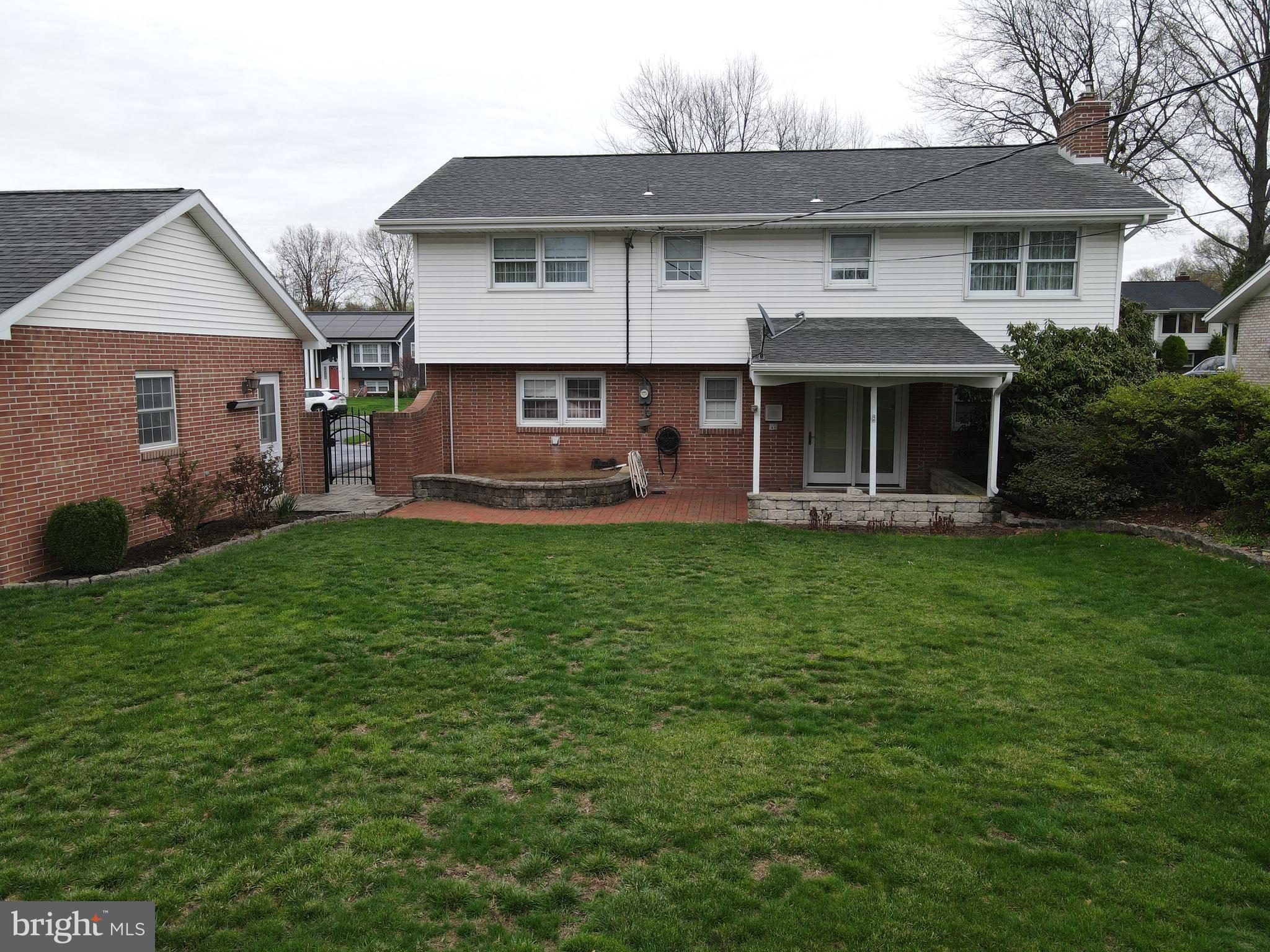 1116 Devonshire Road Lancaster, PA 17601 - Photo 63 of 70 a front view of a house with a yard and trees