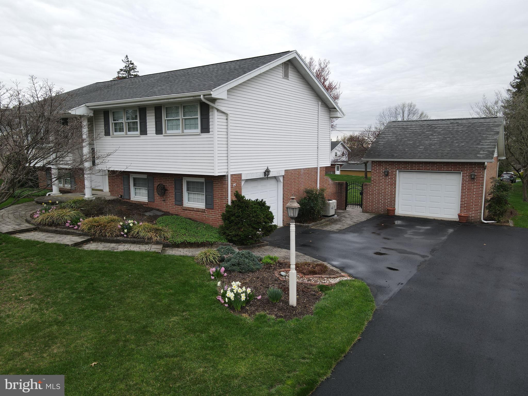 1116 Devonshire Road Lancaster, PA 17601 - Photo 67 of 70 a front view of a house with a garden and plants