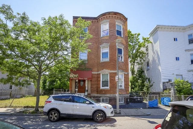 a car parked in front of a building