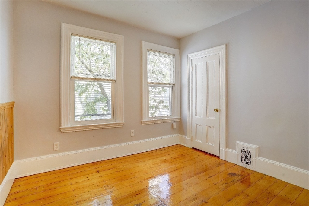 83 Topliff Street, Unit ALL Boston, MA 02122 - Photo 14 of 25 a view of an empty room with a window