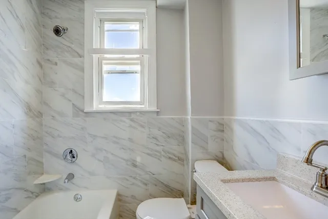 a bathroom with a sink and a toilet