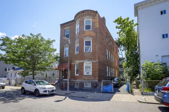 a car parked in front of a house
