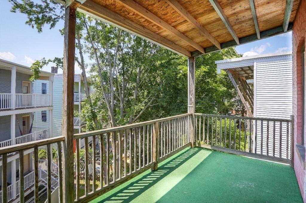 83 Topliff Street, Unit ALL Boston, MA 02122 - Photo 23 of 25 a view of a porch with a yard