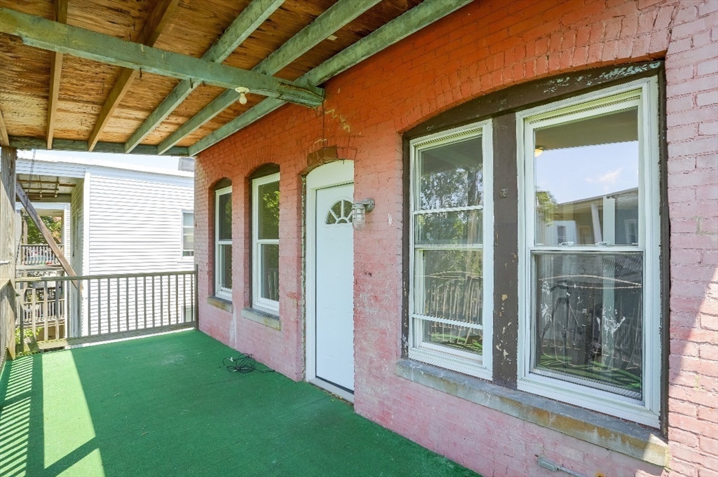 83 Topliff Street, Unit ALL Boston, MA 02122 - Photo 24 of 25 a view of a porch with a backyard