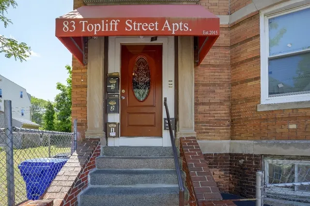 a view of a entryway door front of building
