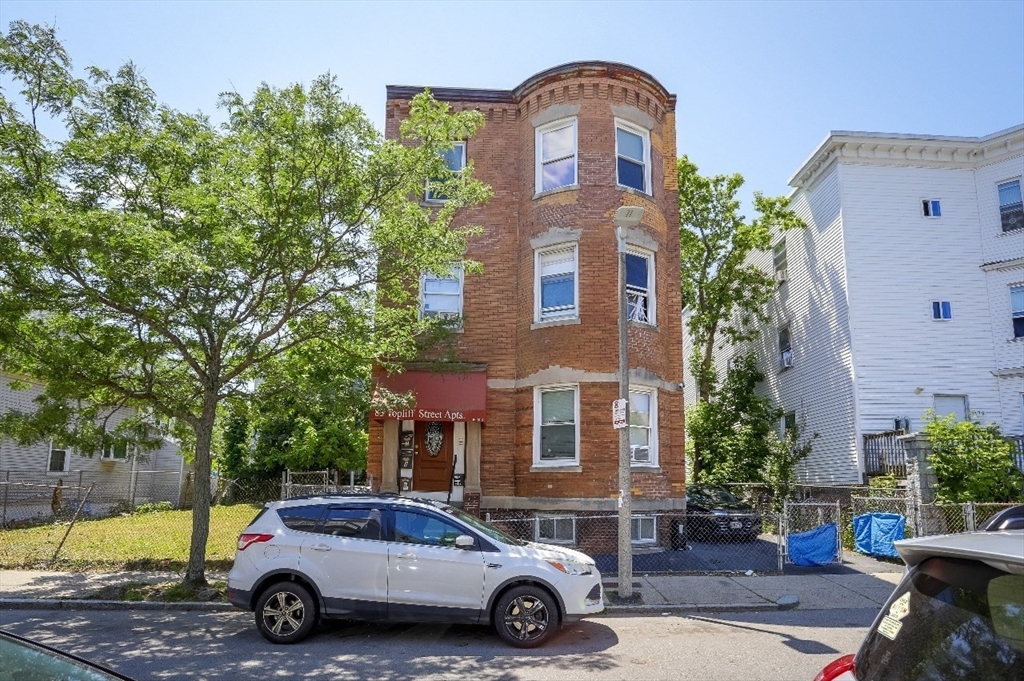 83 Topliff Street, Unit ALL Boston, MA 02122 - Photo 5 of 25 a car parked in front of a building