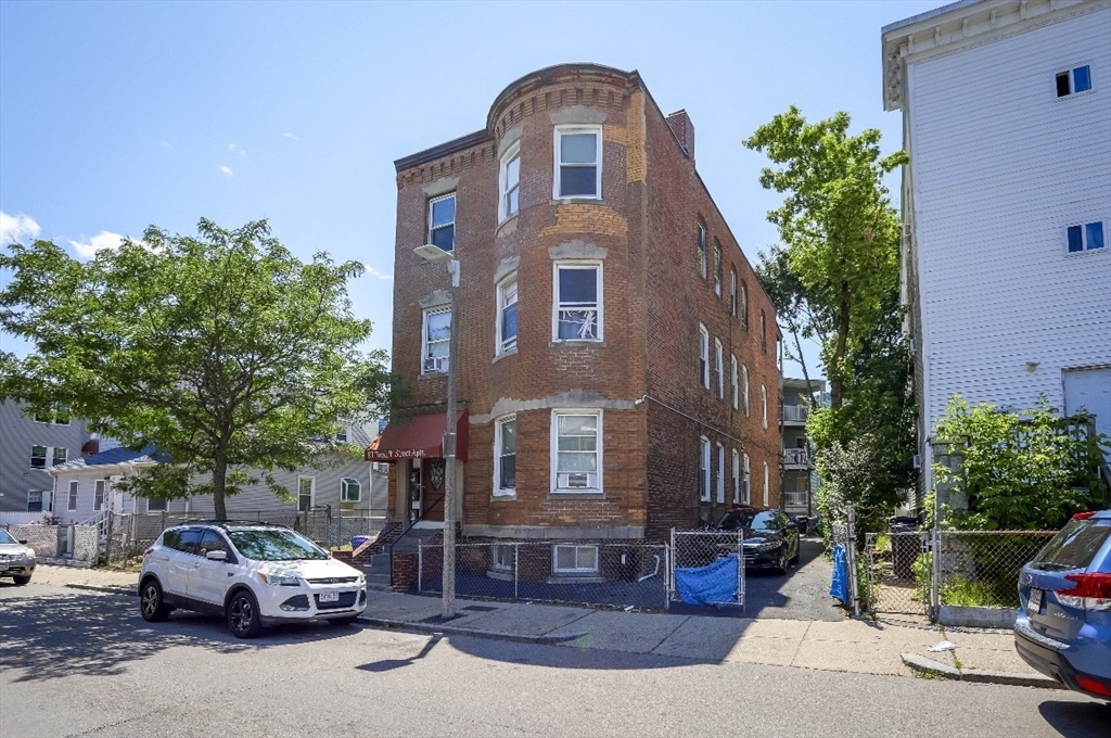 83 Topliff Street, Unit ALL Boston, MA 02122 - Photo 6 of 25 a car parked in front of a house