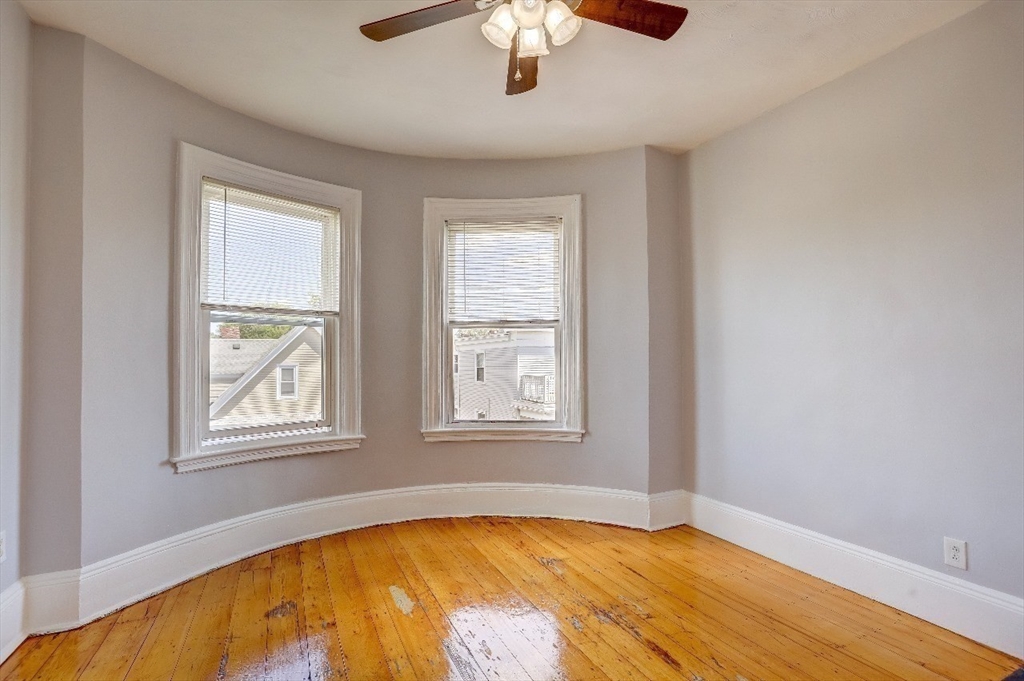 83 Topliff Street, Unit ALL Boston, MA 02122 - Photo 8 of 25 a view of an empty room with window