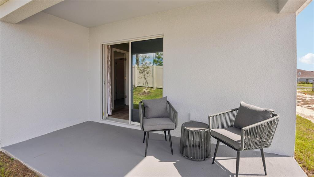 4475 Southwest 85 Lane Ocala, FL 34476 - Photo 19 of 22 a balcony with chairs and a table