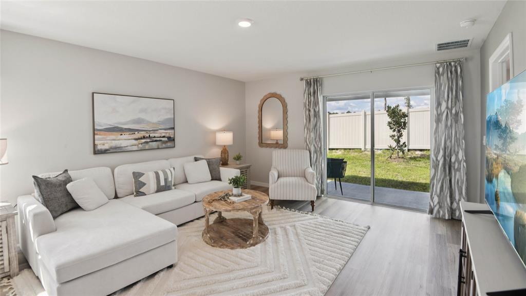 4475 Southwest 85 Lane Ocala, FL 34476 - Photo 9 of 22 a living room with furniture and a large window