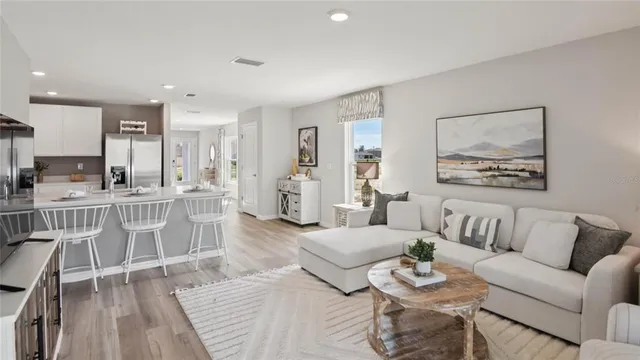 a living room with furniture and a table