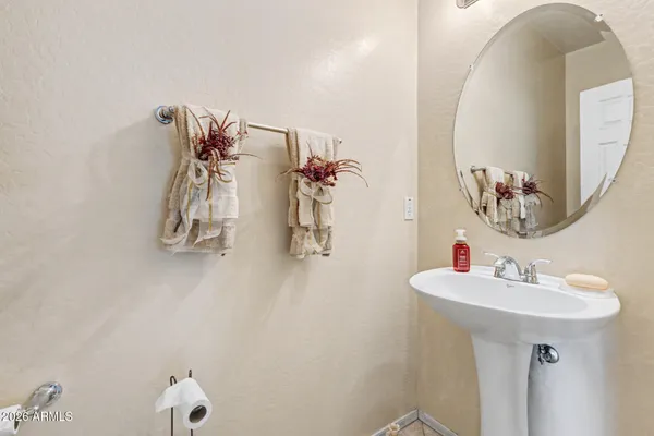 a bathroom with a sink and mirror