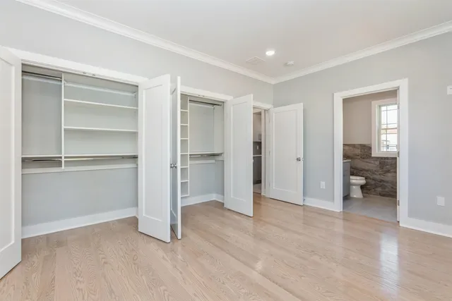 a view of a room with a furniture and a hallway