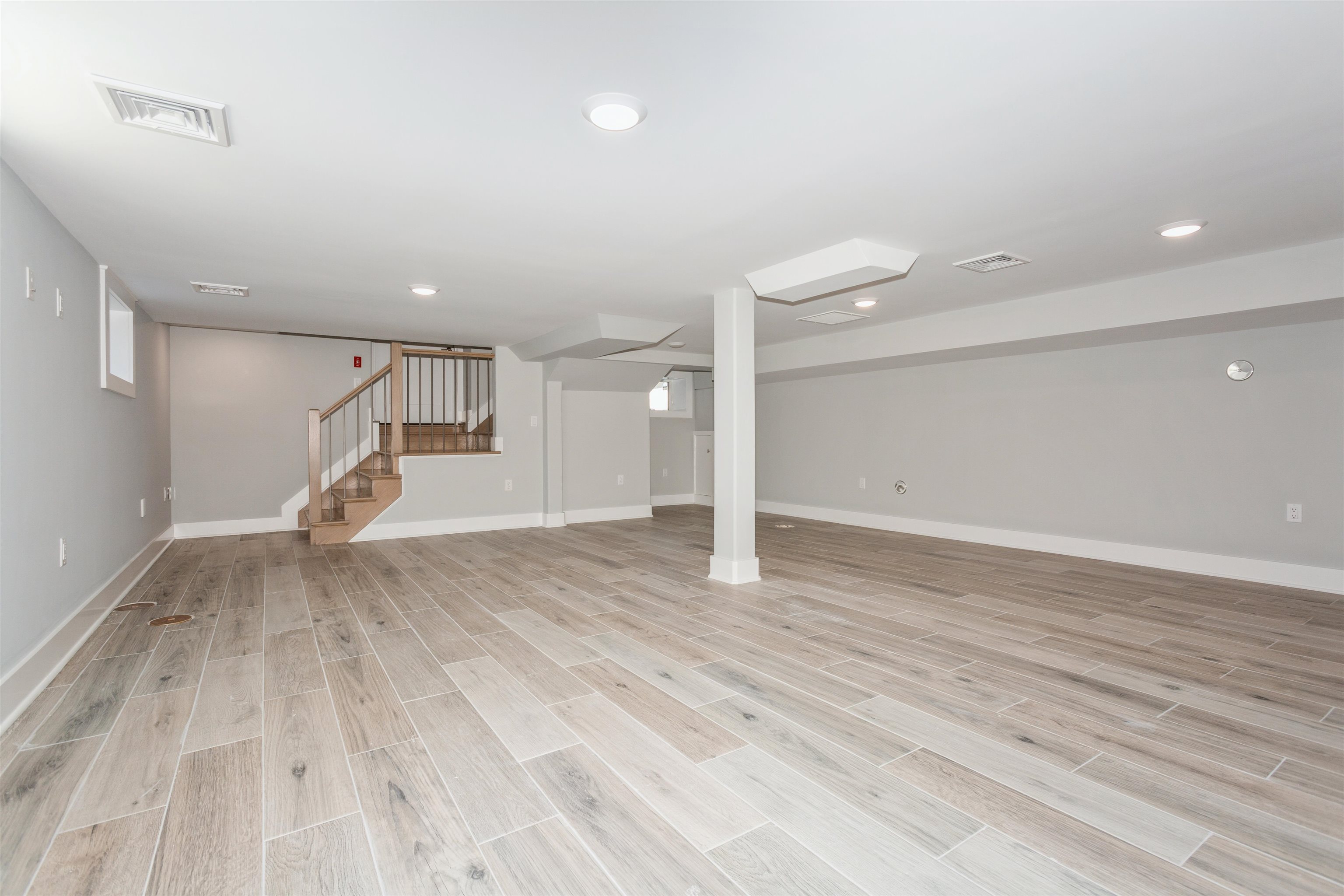 8 Gregory Road Springfield, NJ 07081 - Photo 22 of 30 a view of empty room with wooden floor