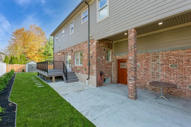 a view of an house with backyard porch and furniture