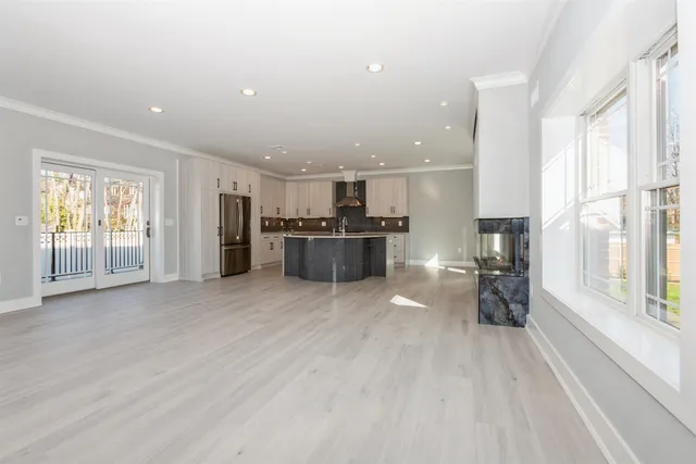 a view of a kitchen with a stove cabinets and wooden floor