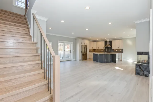 a view of livingroom with kitchen island furniture and fireplace