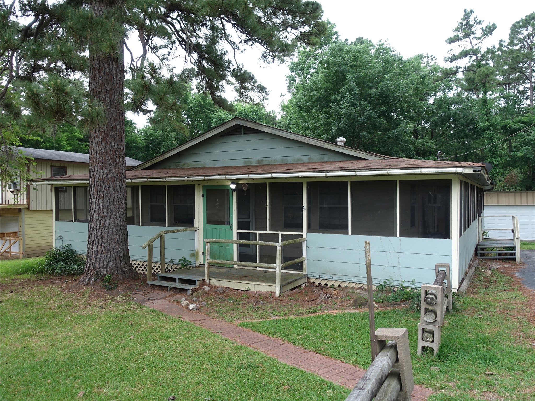 20 Hideaway Trail Coldspring, TX 77331 - Photo 1 of 24 a house view with a garden space