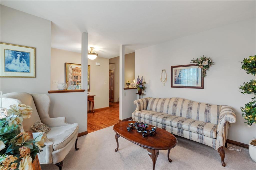 3746 Matthews Road Edinburg, PA 16116 - Photo 13 of 36 a living room with furniture and a potted plant