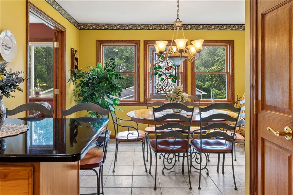 3746 Matthews Road Edinburg, PA 16116 - Photo 21 of 36 a view of a dining room with furniture window and outside view