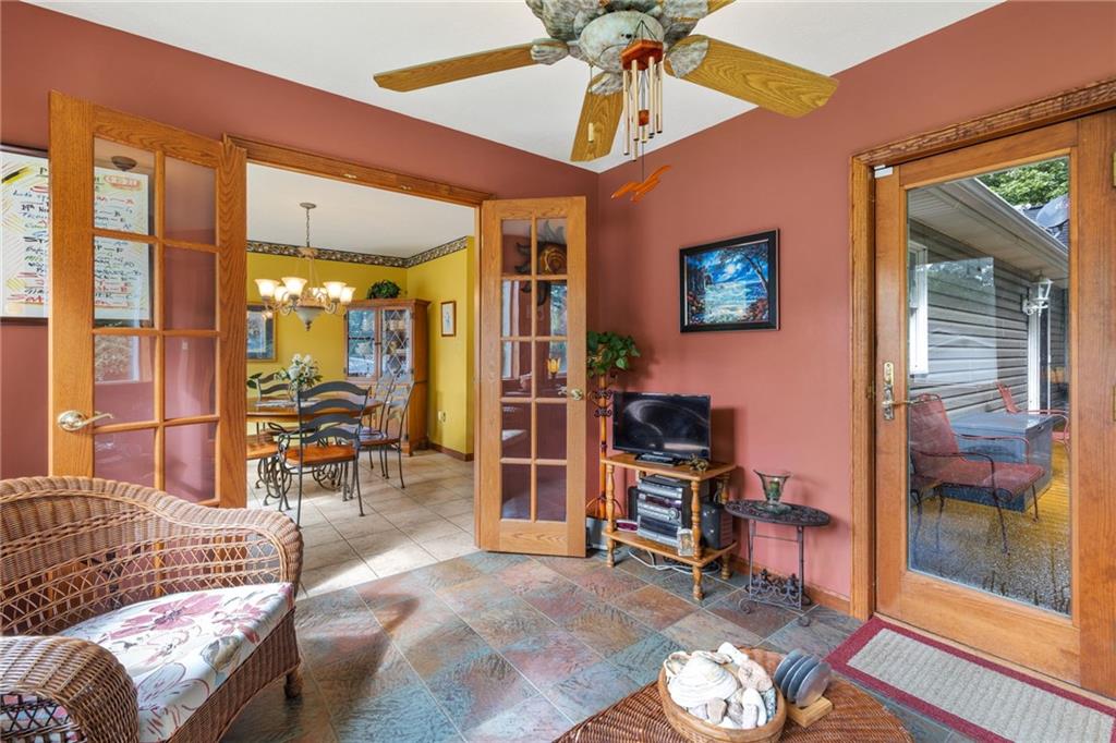 3746 Matthews Road Edinburg, PA 16116 - Photo 25 of 36 a living room with furniture a rug and a window